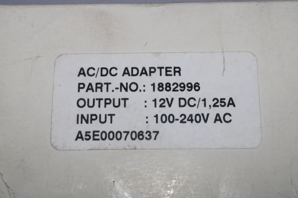 ac-dc-adapter-1882996-12v-1-25a-eu-plug-box-closeup.webp